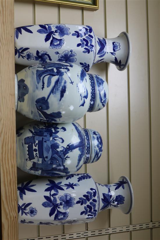 A pair of Chinese blue and white jars and cover and a pair of blue and white vases